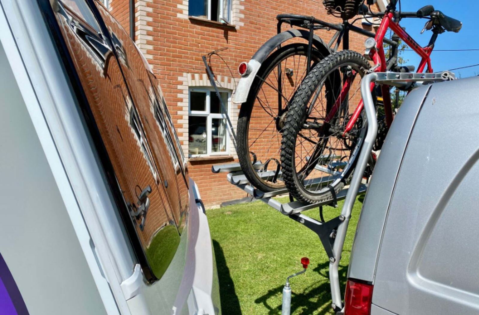 A rear mounted bike rack on the back of a caravan